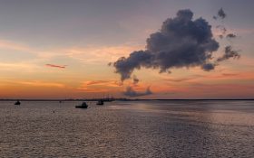 "Dawn over Darwin Harbour, with cloud generated by Inpex LNG plant" by Geoff Whalan is licensed under CC BY-NC-ND 2.0