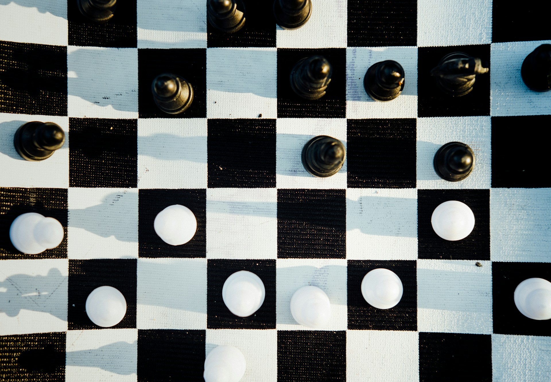 Photo by <a href="https://unsplash.com/@timberfoster?utm_source=unsplash&utm_medium=referral&utm_content=creditCopyText">Tim Foster</a> on <a href="https://unsplash.com/photos/black-and-white-chessboard-iNDR8z_Orww?utm_source=unsplash&utm_medium=referral&utm_content=creditCopyText">Unsplash</a>